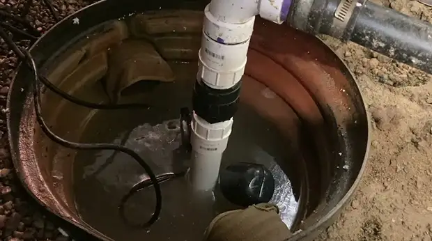 How far above the Sump Pump Should the Check Valve be Installed