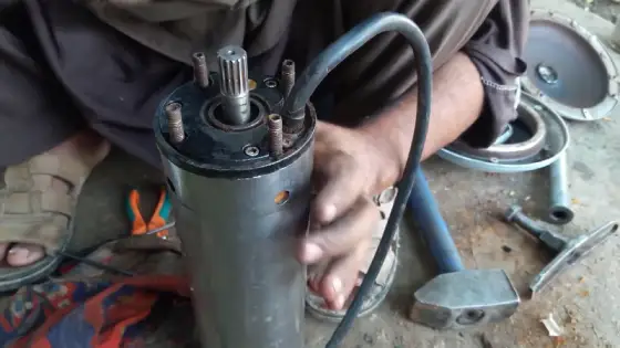 What tools are required to disassemble a submersible pump