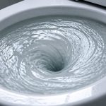 toilet briefly backs up then drains